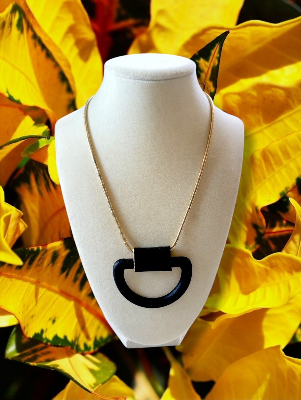 Long Gold Tone Large Black Faux Leather Wrapped Half Moon Pendant Necklace